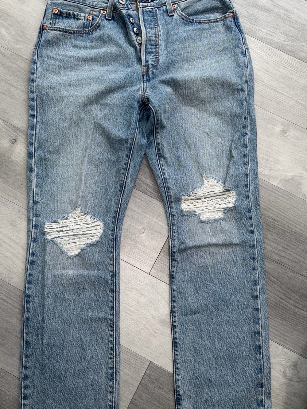 Woman’s Levi 501 Light Blue Straight-Leg Distressed Jeans
